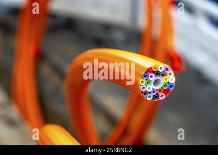 Empty conduits for fibre optic cables, protective conduit in orange, containing the empty conduits for the actual fibre optic cables, which are then b Stock Photo