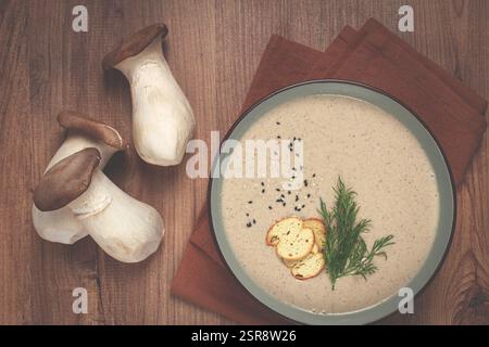 Mushroom cream soup, with dill and bruschetta, mushroom eringi Stock Photo
