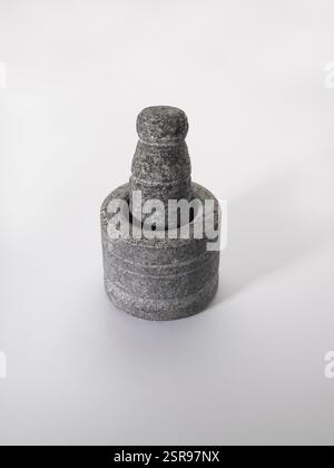 Old stone grinder on white background Stock Photo