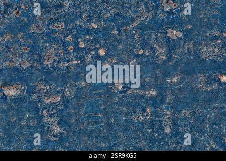 Detailed close-up of a rusty blue metal surface with weathered patterns, corrosion spots, and grunge texture. Perfect for backgrounds, industrial them Stock Photo