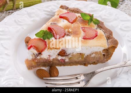 Rhubarb cakes with meringue and almonds Stock Photo