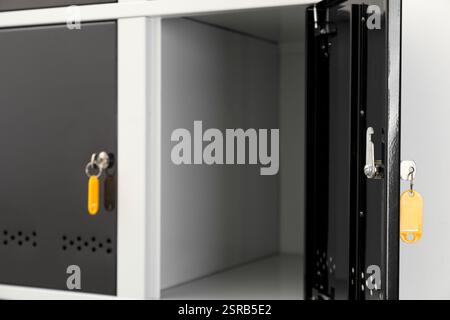 Modern lockers with bright keys indoors, closeup Stock Photo