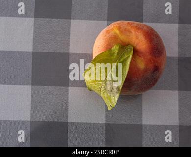 A beautiful shot of a peach in natural light. Stock Photo
