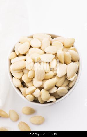 Bowl of almonds on a white background Stock Photo