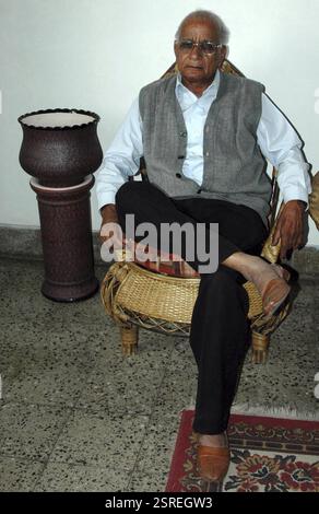 Old man sitting on chair, bhopal, madhya pradesh, india, Asia Stock Photo