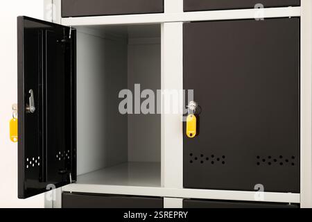 Modern lockers with bright keys indoors, closeup Stock Photo