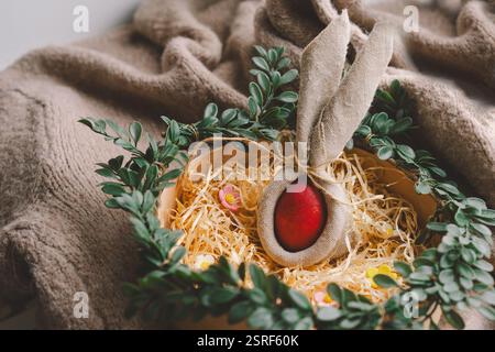 Easter decoration featuring colorful eggs arranged in a cozy nest Stock Photo