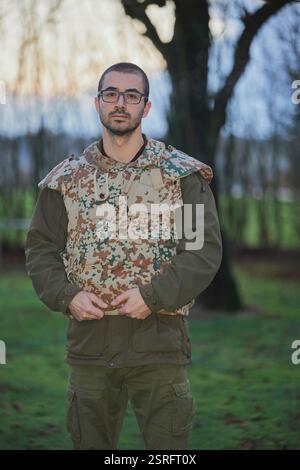 Ukrainian soldier in the autumn forest. Portrait Stock Photo