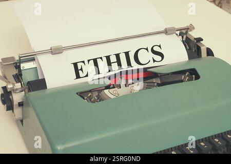 The word ETHICS is written on a vintage typewriter. Stock Photo