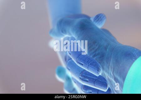 Robot and human handshake, joint efforts, collaboration Stock Photo
