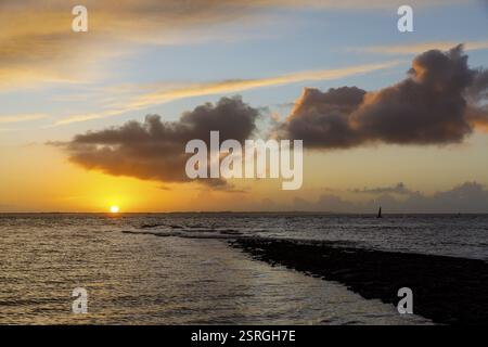 Intense sunset with groyne on the west beach of Norderney, Lower Saxony, Germany, Europe Stock Photo