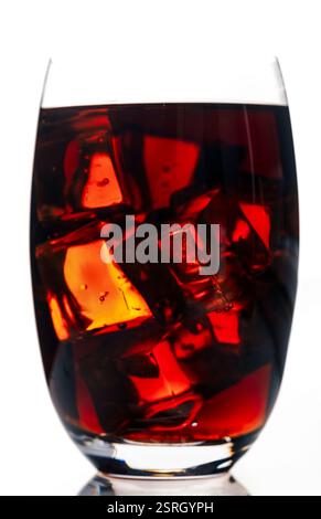 Summer refreshing drink with ice. Cola or rum with ice. Stock Photo