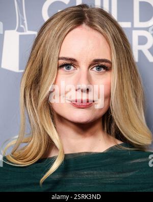 Justine Lupe arrives for the 77th annual Primetime Emmy Awards at the