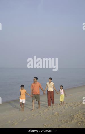 South Indian family walking together in a park Stock Photo - Alamy