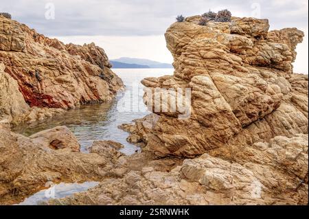 Rugged rocky coast of the Plage de Stagnoli on the Mediterranean Sea, Gulf of Sagone, west coast of Corsica, Corsica, France, Europe Stock Photo