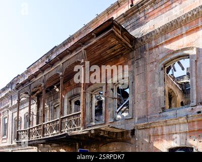 old wooden balcony on house destroyed during earthquake on Ajemyan street in Kumayri Historical and Cultural Museum-Reserve district in Gyumri old cit Stock Photo