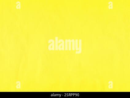 Yellow, contrasting surface of an old paper or cardboard, background, texture. Backdrop of aged, dented, yellow paper surface. Light-yellow covering Stock Photo