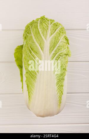 chinese cabbage on white wood background top view Stock Photo