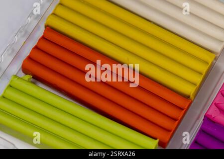 plasticine of different colors for modeling, a simple multi colored plasticine that is used in children's creativity Stock Photo