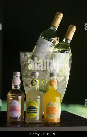 Wine (Tuffolo) and lemonade (Rose, Victorian, Mandarin) in an ice bucket. Stock Photo