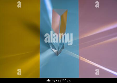 Minimalist abstract background made of overlapping yellow, pink, and blue paper. Geometric composition ideal for design, branding, or creative project Stock Photo