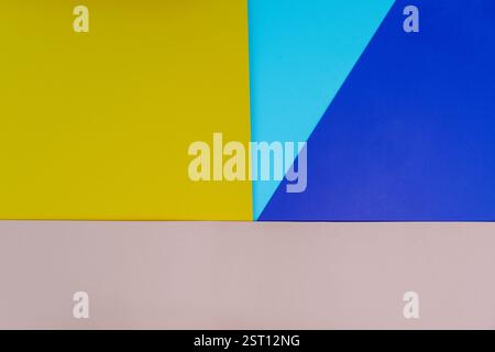 Modern abstract composition featuring geometric shapes in yellow, blue, light blue, and beige paper. Vibrant and creative background for design, brand Stock Photo