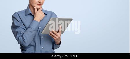 Modern Technologies For Business. Thoughtful Businesswoman Using Digital Tablet, Website Banner Stock Photo