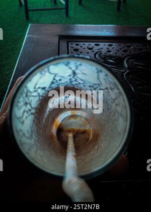 Top view of an empty glass with straw, showing coffee stains and textured residue on the inner surface. The image captures the everyday moment after f Stock Photo