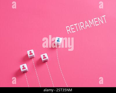Conceptual image of employee reaching retirement age with cubes showing the way to the word retirement. Stock Photo