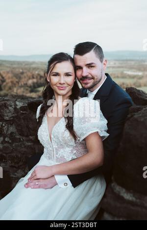 Portrait of beautiful wedding couple, looking at camera and smiling. Stock Photo