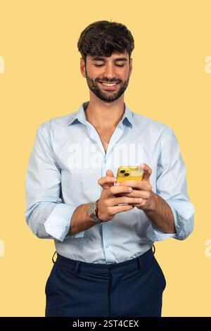 Young businessman is using mobile phone, texting and browsing social media Stock Photo