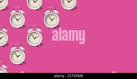 White alarm clocks on violet red background, pattern. Banner design with space for text Stock Photo