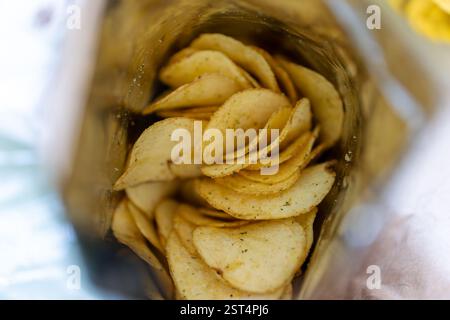 close-up look inside a bag of potato chips or packet of crisps, cheese and onion flavor Stock Photo