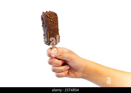 Ice cream covered with chocolate and almonds sticks in hand isolated on white background. Stock Photo