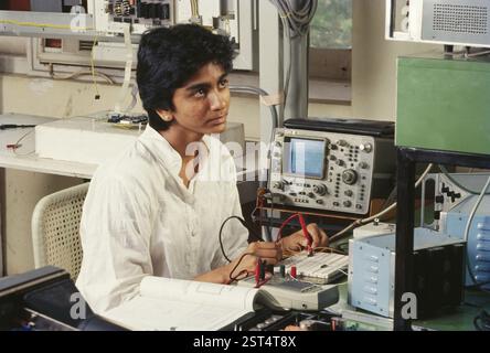 Woman working in electronic industry, india Stock Photo