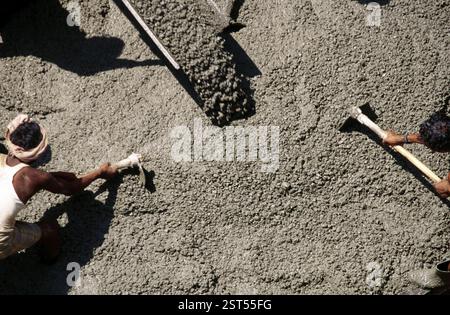 Men working on road construction site, India, Asia Stock Photo