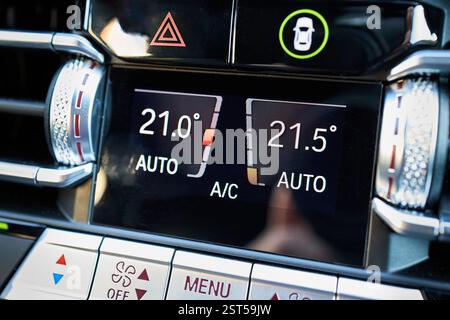 Automotive detailing climate control display dashboard switch mode buttons Emergency Light Switch and safety system Button close up. Luxury contempora Stock Photo