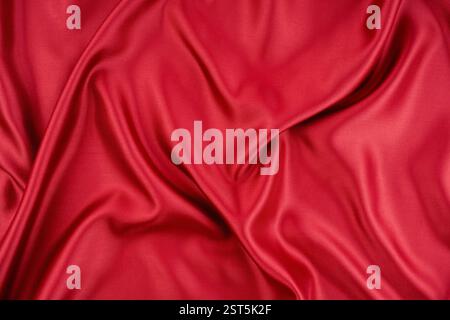 Texture of beautiful deep red silk fabric as background, closeup Stock Photo