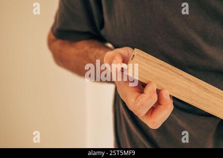 Using wooden dowels while assembling furniture at DIY home project, selective focus Stock Photo