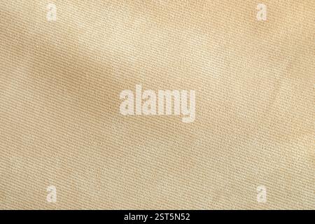 Beige sofa couch fabric material sample texture as background, top view Stock Photo