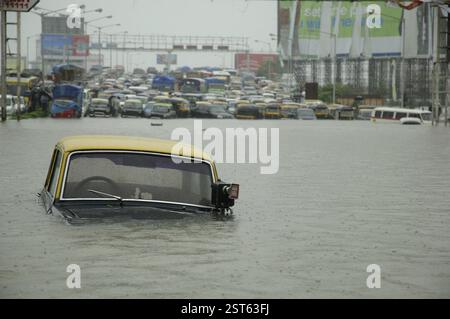 Floods due to heavy rain, showing vehicles submerged in flooded water ...