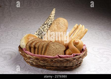 Assorted bread basket, bun whole wheat, lavas, french bread, bread sticks, croissant, dinner roll Stock Photo