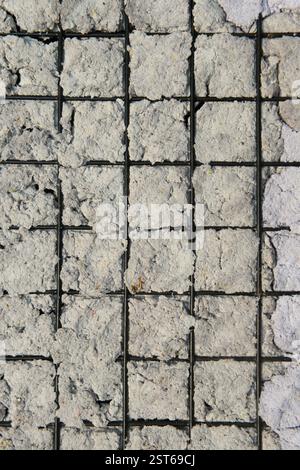 Texture of Handmade Paper on a black metal grid. Stock Photo