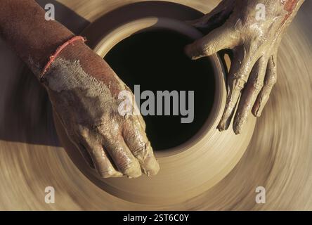 Pottery, potter giving shape to clay pot on wheel, Bikaner, Rajasthan, India, Asia Stock Photo