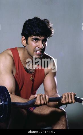 Man doing exercise using weight equipment MR#139 Stock Photo