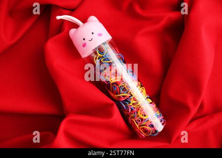 Container with many elastic bands Stock Photo