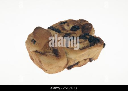 Cinnamon raisin bun tea bread (as in bun) n. sweetened buns to be eaten with tea Stock Photo