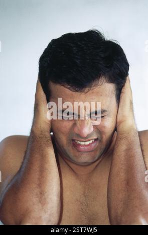 Man suffering through headache, india MR#511 Stock Photo
