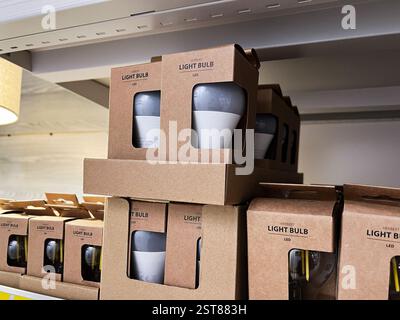 Lviv, Ukraine - February 16, 2025: LED light bulbs packaged in eco-friendly boxes displayed on retail store shelving Stock Photo
