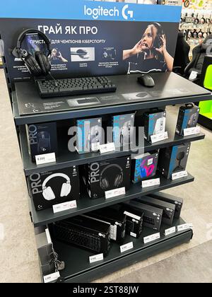 Lviv, Ukraine - February 16, 2025: A selection of Logitech gaming equipment displayed on shelves within a store setting. Stock Photo
